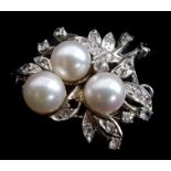 A diamond and cultured pearl floral spray brooch, set in white metal, scratch marked 14K, 2cm max