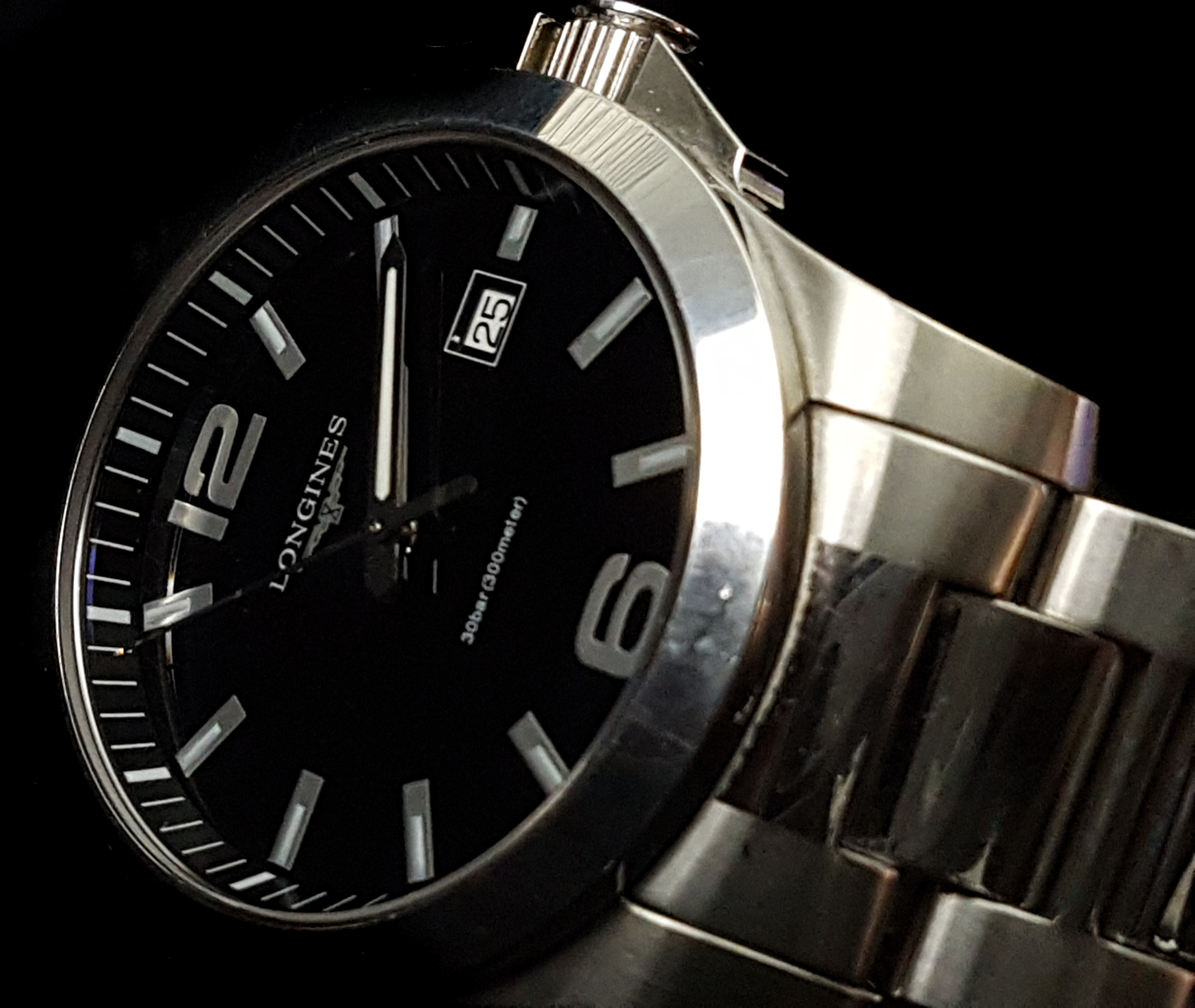 A Longines Gentleman's stainless steel wristwatch, black dial marked 30 bar (300 meters) the black