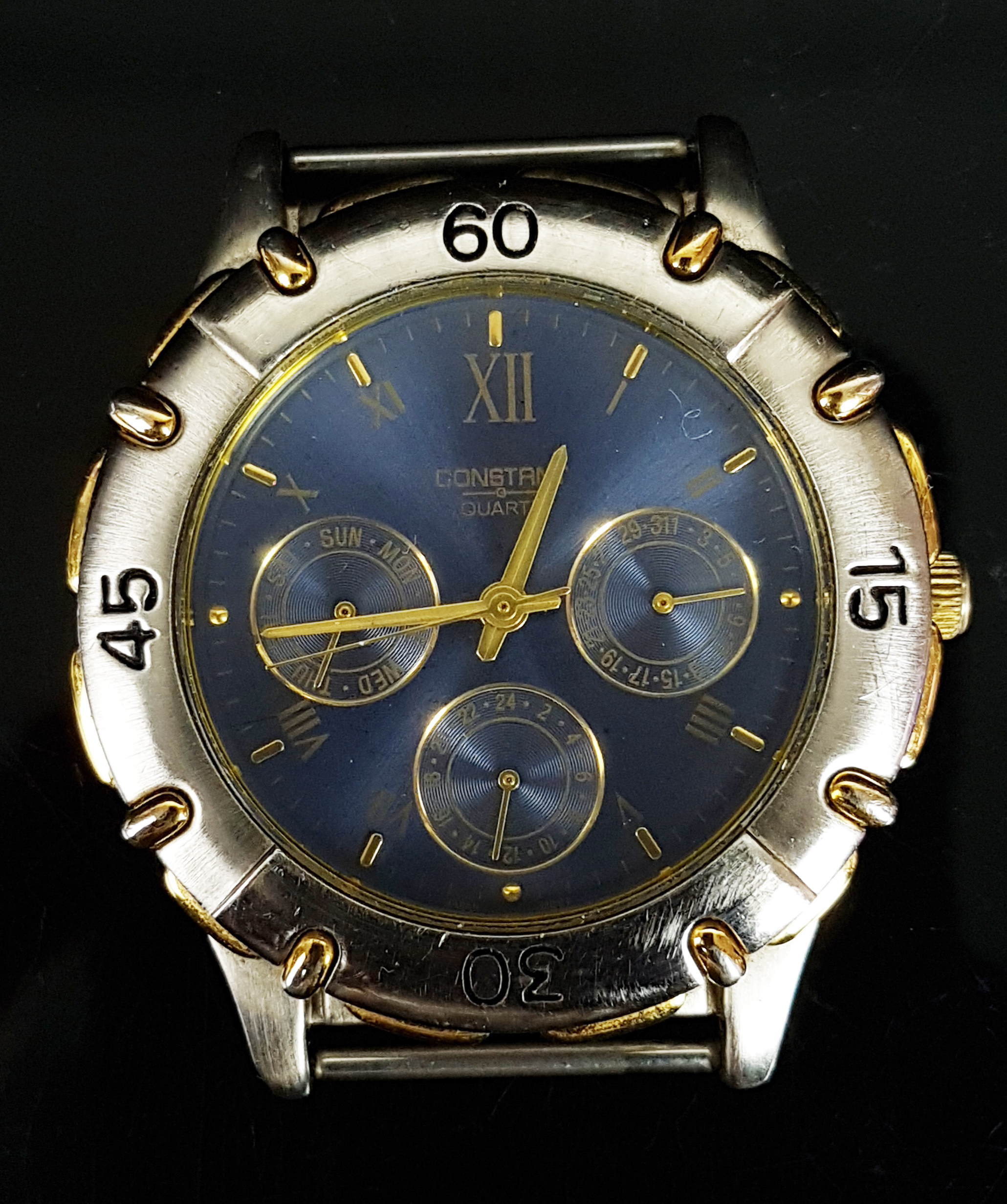 A Constant gentlemans wristwatch, the blue dial with day, date and month subsidary dials, 3.7cm