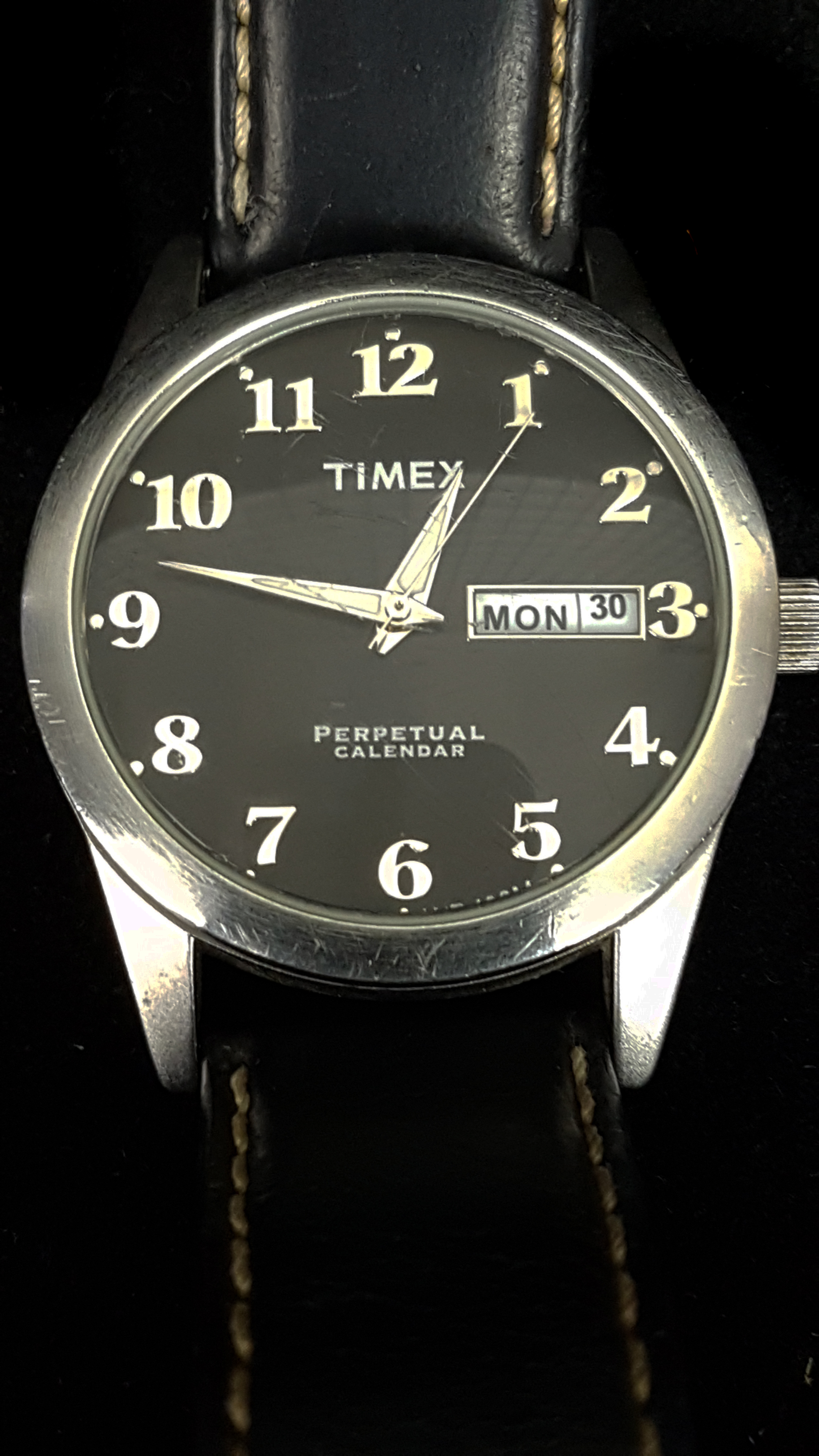 A Timex perpetual calendar wristwatch. Stainless steel, black dial with rectangular day and date - Image 2 of 2