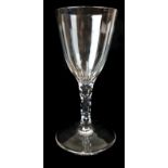 An English wine glass, on honeycomb cut stem on spreading foot, 16cm high