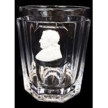 A Baccarat sulphide glass beaker, the colourless glass beaker facetted with single panel enclosing a