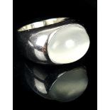 A quartz moonstone ring, oval cabouchon stone set in white metal, unmarked white gold. Ring size Q.