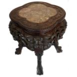 A Chinese hardwood carved stand, of quatrefoil shaped top, inset with variegated red/ochre marble,