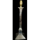 A silver plated corinthium column lamp base, fitted for electricity, makers mark HE&Co,