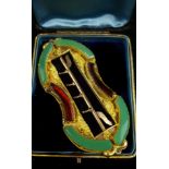 A French yellow metal ornate belt buckle, set with paste 'jade' and garnet coloured curved panels,