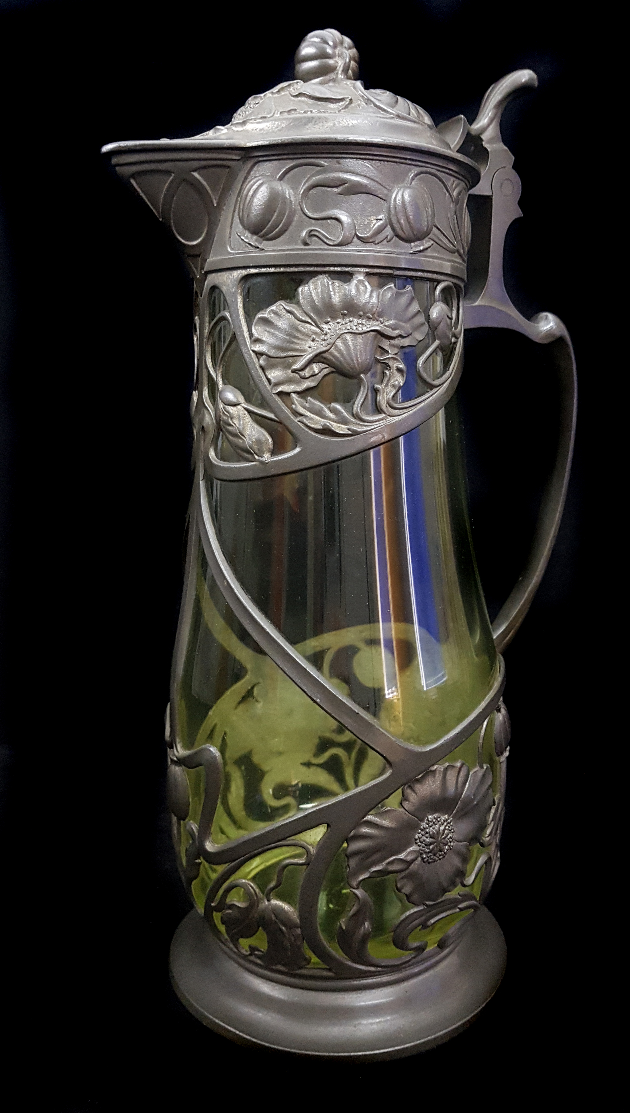 A pair of Continental pewter mounted glass claret jugs, the metal formed as Art Nouveau floral - Image 3 of 4