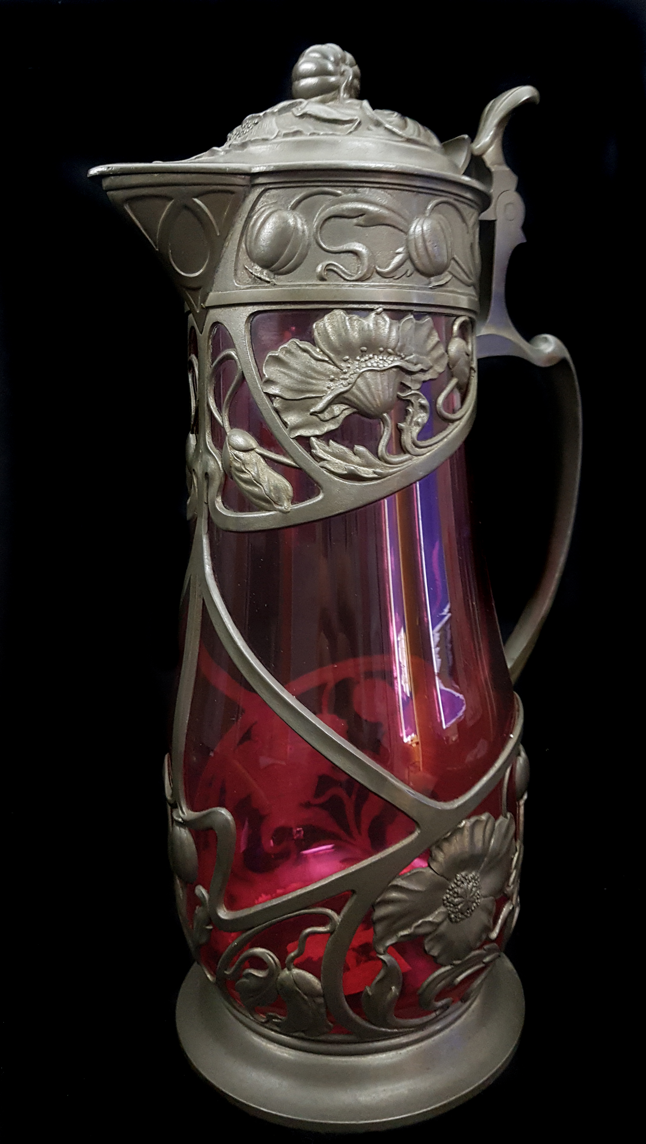 A pair of Continental pewter mounted glass claret jugs, the metal formed as Art Nouveau floral - Image 4 of 4