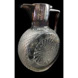 A cut glass silver plated mounted claret jug, circular body with star cut roundel 19cm high