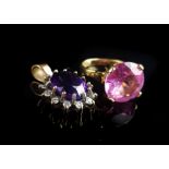 An amethyst and cubic zirconia pendant set in yellow metal; and a pink stone ring set in yellow