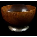 A turned wood Mazer bowl, the interia set with a large cabouchon Tigers Eye stone with metal mount