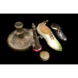 A Continental porcelain shoe form pin cushion, green colour; and another of brown glaze; a brass