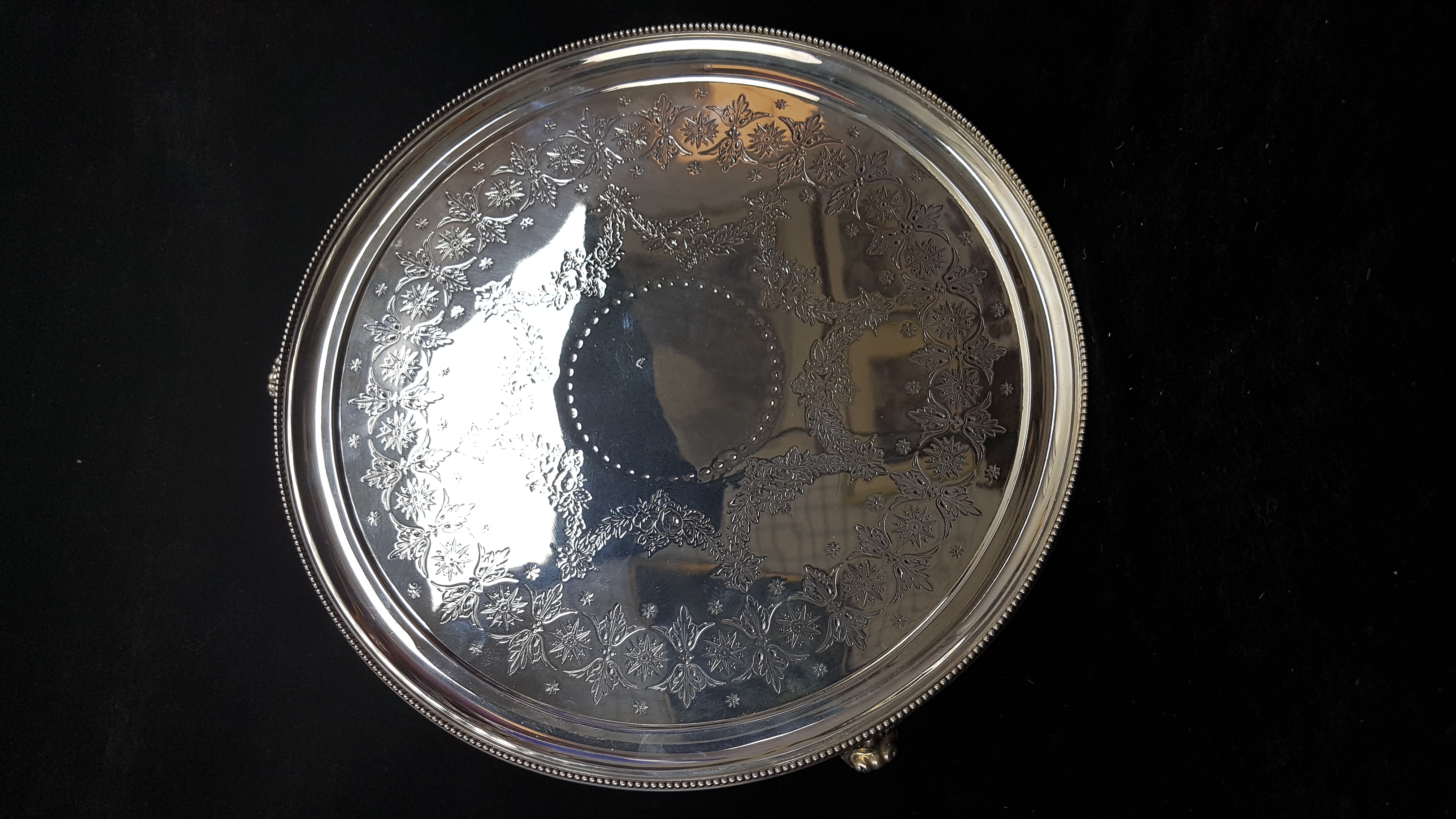 A circular silver salver, decorated with summer flower swags with a stiff leaf and star border, - Image 2 of 2