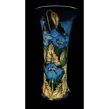 Philip Gibson for Moorcroft Pottery. A blue Rapsody pattern waisted cylindrical vase, produced for