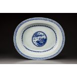 A large blue and white oval platter