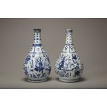 A pair of blue and white bottle vases