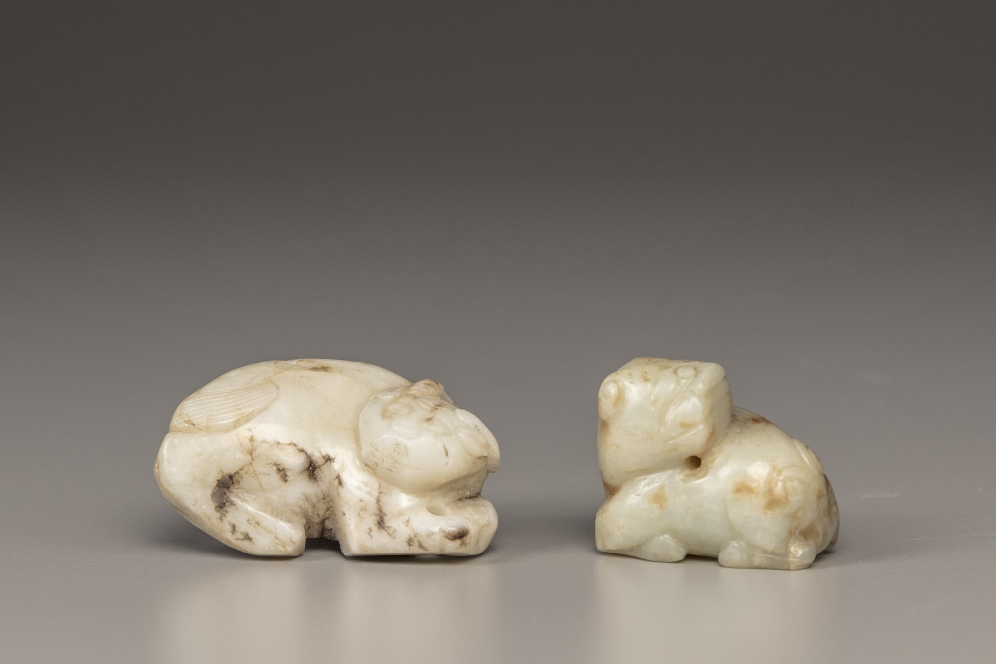 A creamy jade water buffalo and a celadon and russet jade Buddhist lion - Image 3 of 4