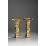 A large pair of gilt bronze archaistic square-section flaring vases, gu