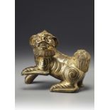 A gilt bronze Buddhist lion