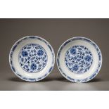 A pair of blue and white lotus dishes