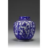 A blue overlay white glass 'floral' jar