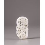 A Chinese white jade 'twin dragon' plaque