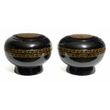 A set of two large black lacquered food-containers