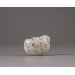 A Chinese white jade carving of a water caltrop