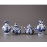 Two pairs of Chinese blue and white miniature vases and teapots