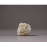 A Chinese celadon jade 'duck and lotus' carving