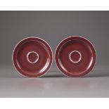 A pair of Chinese copper-red-glazed saucers