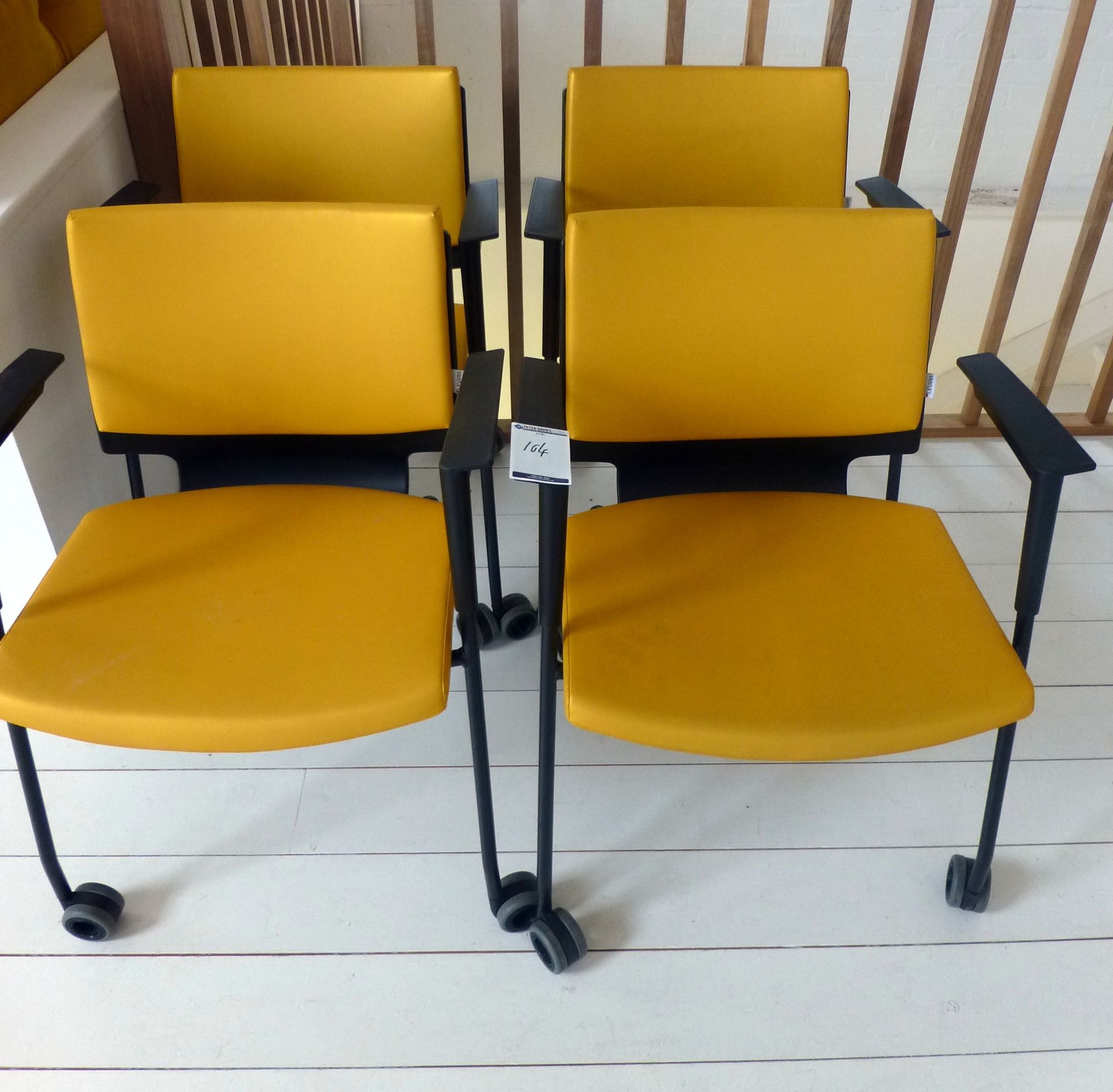 4 Levira Yellow Leatherette Wheeled Arm Chairs (located at 1st floor, Old Dairy Court, 17 Crouch