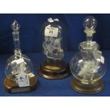 Three small spun glass ships to include: 'Mayflower, dated 1620 and 'Arab Dhow',