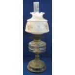 Early 20th Century brass double burner oil lamp with glass reservoir on brass pedestal with ceramic