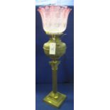 Brass Corinthian column oil lamp with repousse brass reservoir,