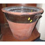 Large terracotta pottery, partly glazed, two handled dairy pan.