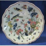 19th Century French tin glazed Faience shallow dish, overall painted with sprays of flowers,