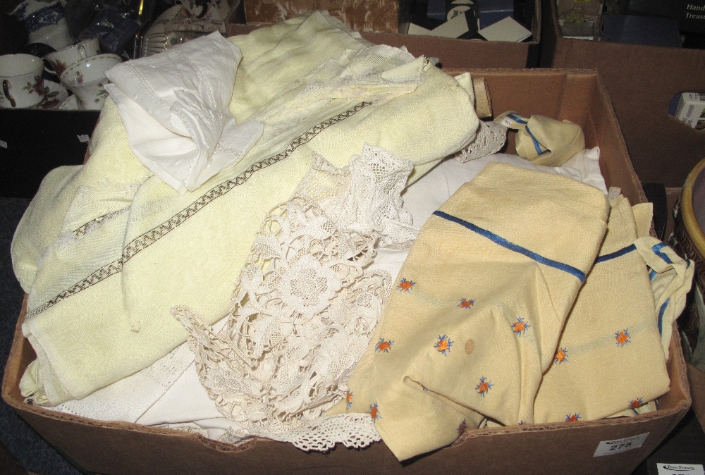 Large box containing various tableware, lace, linen and other fabrics.