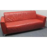 20TH CENTURY ITALIAN DESIGNER RED LEATHER SOFA on short chrome legs. 192 x 83 x 79cm.