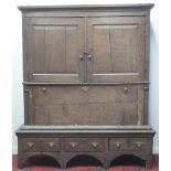 18TH CENTURY WELSH OAK CUPBOARD on stand, a reconstruction with two blind,