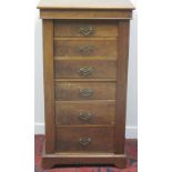 LATE VICTORIAN MAHOGANY WELLINGTON CHEST of six drawers on a bracketed, platform base.