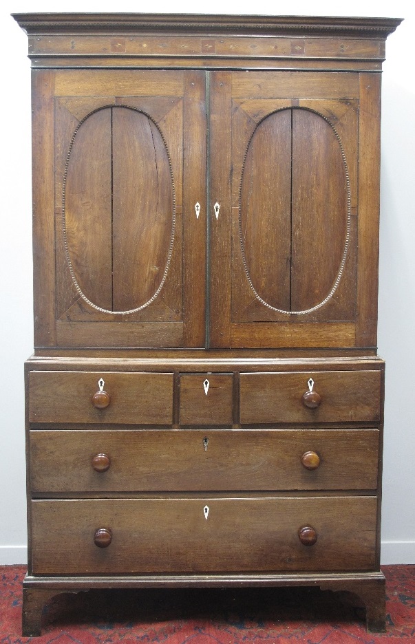 EARLY 19TH CENTURY WELSH OAK, TWO STAGE PRESS CUPBOARD, having fluted,