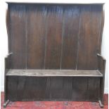 EARLY 19TH CENTURY OAK CURVED SETTLE, having flat canopy top, shaped sides and solid, shaped arms,