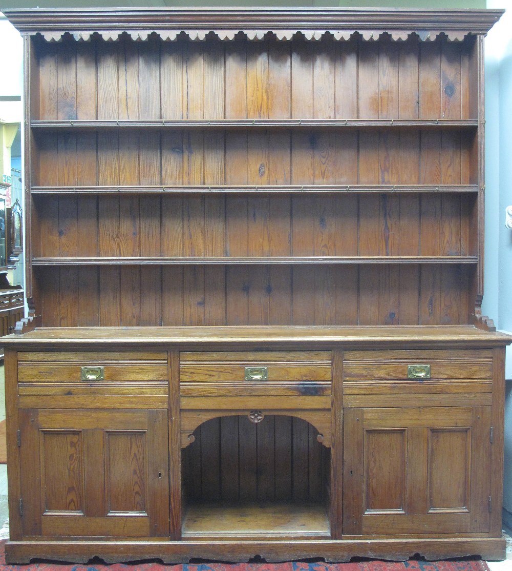 LARGE LATE 19TH CENTURY PITCH PINE DRESSER, having moulded cornice over angular,