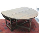 LARGE 17TH CENTURY OVAL OAK GATE LEG TABLE, having oval shaped leaves on a gun barrel turned,