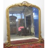 19TH CENTURY GILT FRAMED, ARCHED, OVER MANTEL MIRROR, having ribboned cresting and beaded frame,