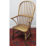 19TH CENTURY ASH AND ELM HOOP BACKED ELBOW CHAIR with baluster turned supports and moulded seat on