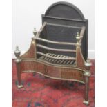 REGENCY DESIGN CAST IRON AND BRASS FIRE GRATE, having arched back, urn finials,