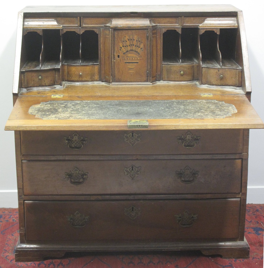 18TH CENTURY MAHOGANY BUREAU, having stepped interior with inlaid central cupboard door,