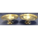 Pair of silver, circular, pierced pedestal bonbon dishes, Birmingham hallmarks.